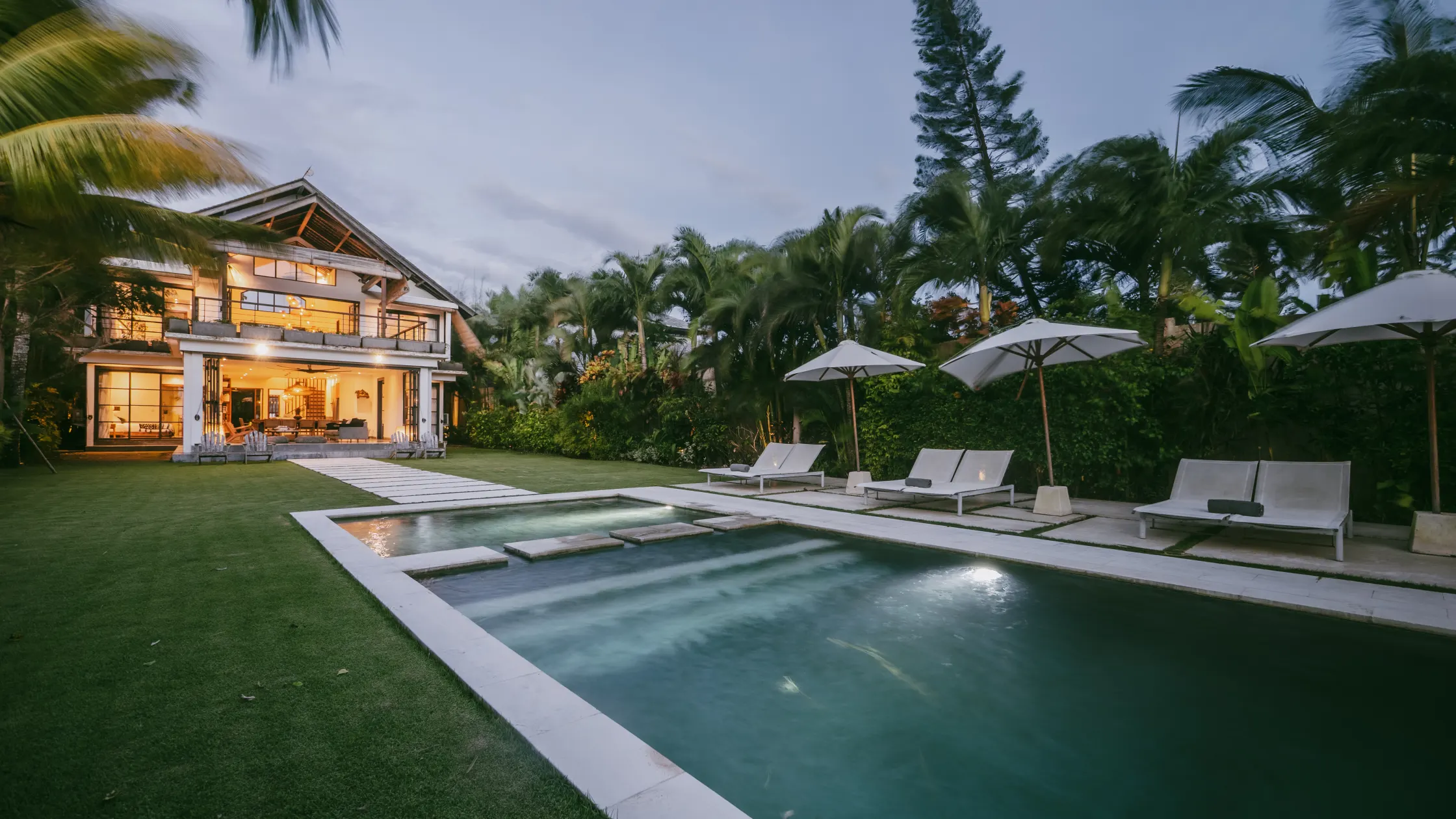 Villa Lux Bali illuminated beside the private pool at twilight
