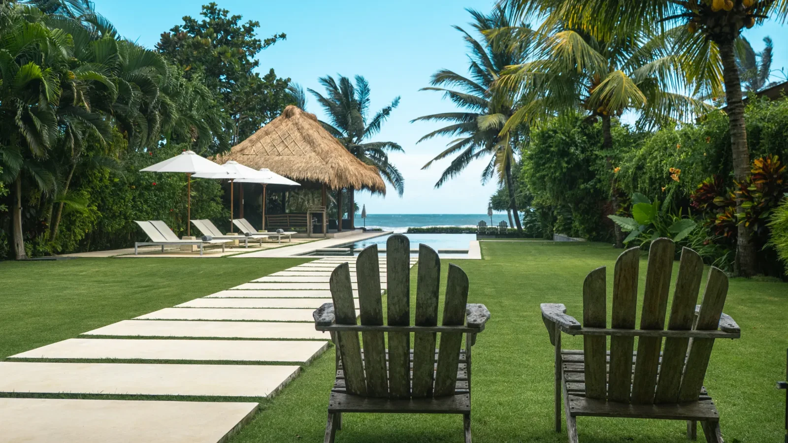 Villa Lux Bali garden and pool overlooking Pasut Beach