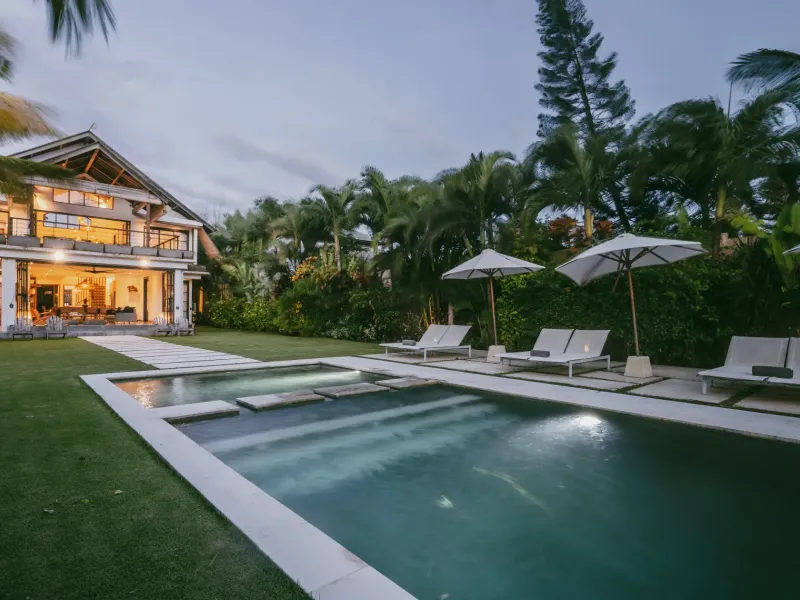 Villa Lux Bali illuminated beside the pool at twilight